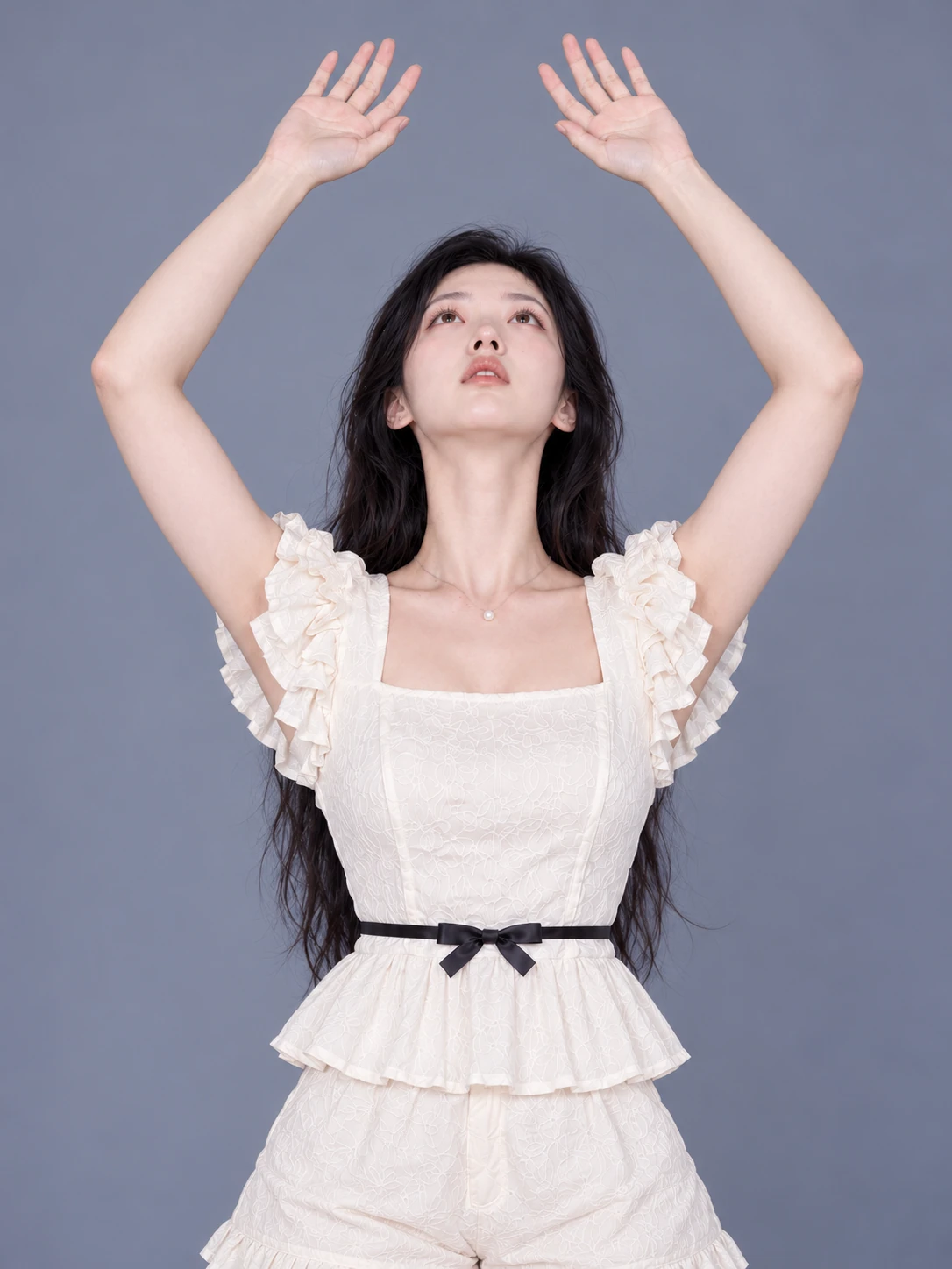 Lying on the back, arching with arms raised / Front